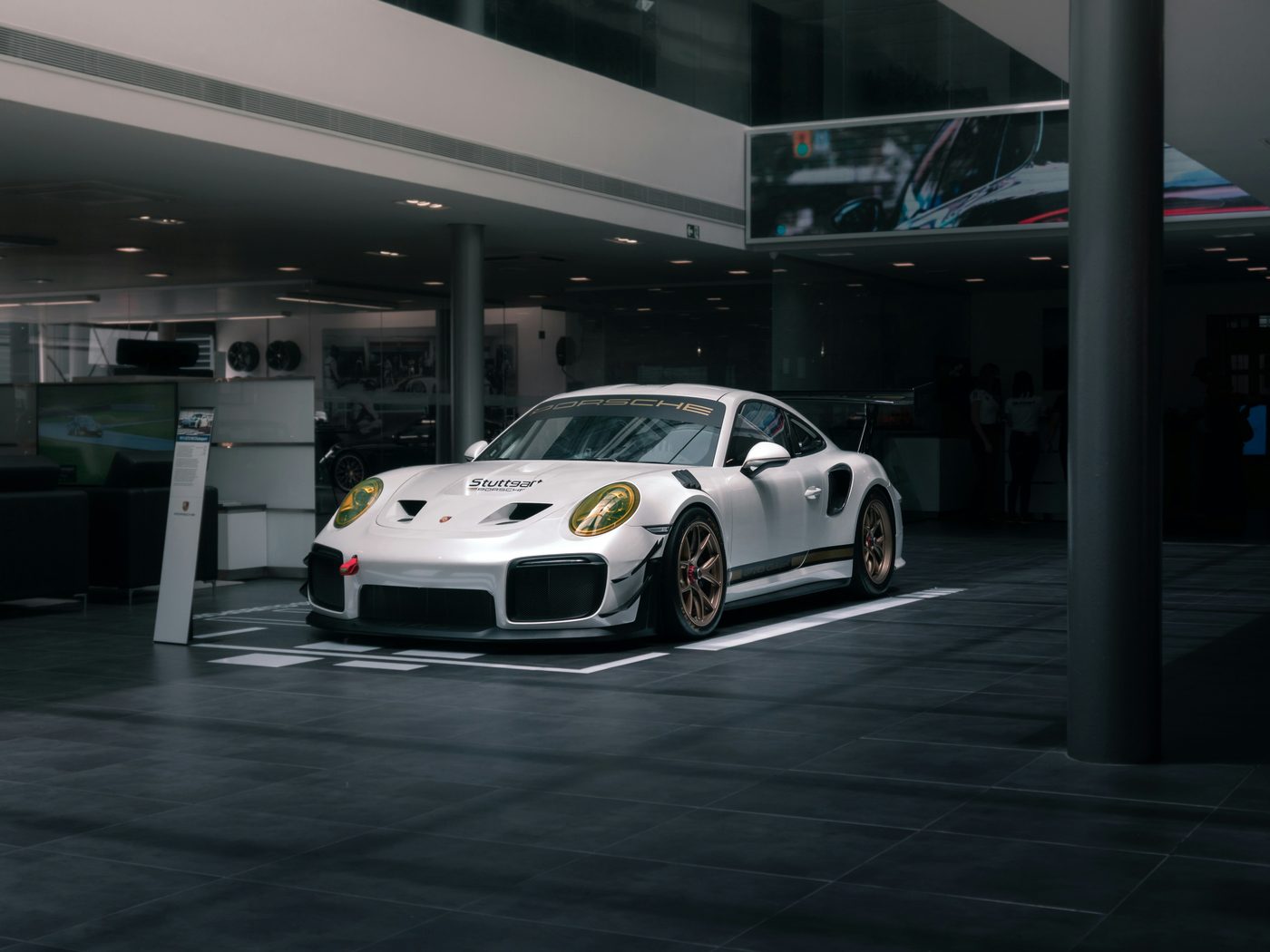 Luxury Porsche on display in a Tristate Auto Leasing showroom